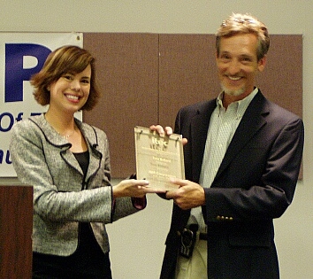 On the right, Tom Ballard, CTO, Hoover's Inc. is honored as Austin's Information Technologist of the Year by IBM's Janice Blanche